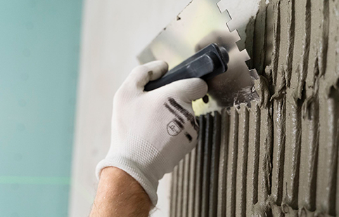 How does a corner trowel enhance plastering?